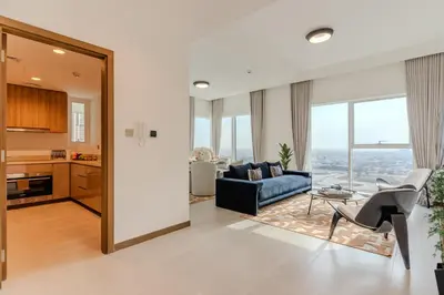 a living room with a couch and a table at DAYF-DAN Missoni Apartment with Private Lift in Business Bay in Dubai