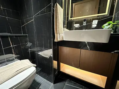 a bathroom with a sink and a toilet at Gorgeous 1br Apt In Jvc in Dubai