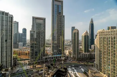 a view of a city with tall buildings at GuestReady - Burj Khalifa View l Infinity Pool in Dubai