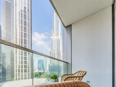 a balcony with a view of a city skyline at 2 BR - Grande Signature - Burj Khalifa View in Dubai