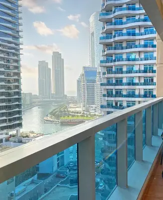 a view from a balcony of a city skyline at Cozy 1 Bedroom Apartment with Marina and Sea View Z1306 in Dubai