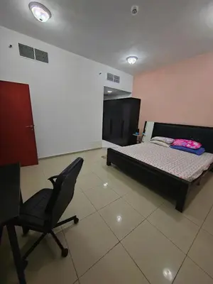 a bedroom with a bed and a chair in it at Private Master Room Marina Beach next to Marriott in Dubai