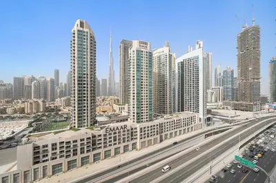 a large city with a highway and many tall buildings at Luxury Living in Sterling West in Dubai