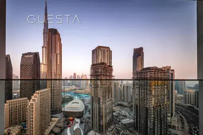 a view of a city from the top of a skyscraper at Forte Tower 1 by Emaar - Dubai Fountain View, Downtown Dubai in Dubai