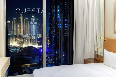 a hotel room with a view of a city at Forte Tower 1 by Emaar - Dubai Fountain View, Downtown Dubai in Dubai