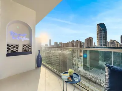a balcony with a view of a city skyline at Luxury Apartment with Balcony & Full Burj Khalifa View by Dejaview Stays in Dubai
