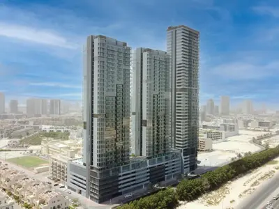 a group of tall buildings in a city at Stylish Studio Living in the Heart of JVC in Dubai