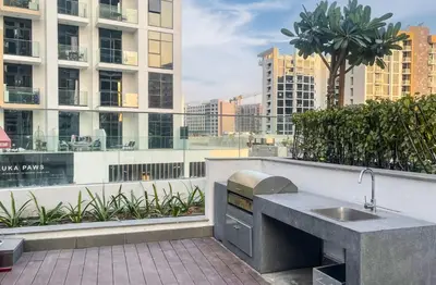 a kitchen with a sink on a balcony at Elite LUX Holiday Homes - Upscale Studio in Azizi Riviera Prime Location Dubai in Dubai
