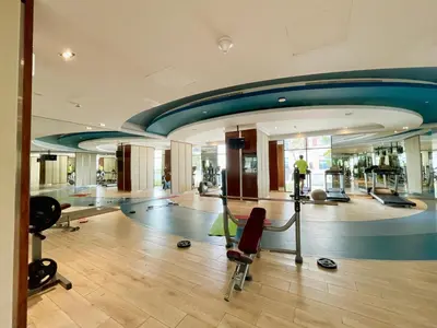 a fitness room with a gym with a treadmill at Vacay Lettings - Modern Studio Near to Expo City in Dubai