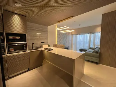 a kitchen with a large island in the middle at Dubai Gate 1 in Dubai