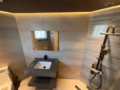 a bathroom with a sink and a mirror at Dubai Gate 1 in Dubai