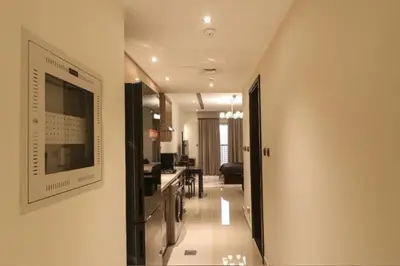 a hallway with a living room and a dining room at Luxurious Elite Studio-DownTown in Dubai