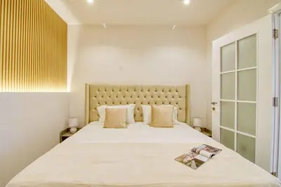 a bedroom with a large white bed with a large window at Dubai Gate 1 in Dubai