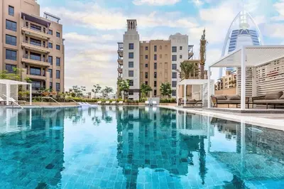 a large swimming pool in a city with buildings at 1 Bedroom Apartment with Burj AlArab View from your Balcony R507 in Dubai