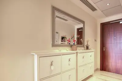 a bathroom with a sink and a mirror at Stylish 2 Bedroom Opera View in Downtown Dubai SP2013 in Dubai