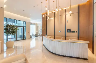a lobby with a reception desk in a building at BLVD - Steps from Dubai mall and Dancing Fountain in Dubai