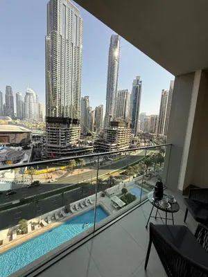 a view of a city from a hotel room at Upgraded brand new apartment Downtown in Dubai