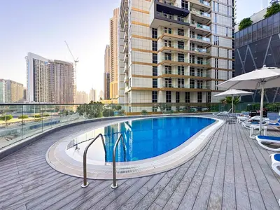 a swimming pool on the roof of a building at Elegant 1BR in Dunya Tower, Downtown Dubai 12AB10 in Dubai