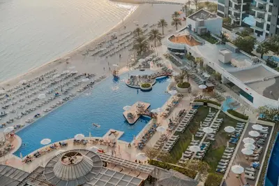 an aerial view of a pool at a resort at Clever Guest 028 Baltic in Dubai