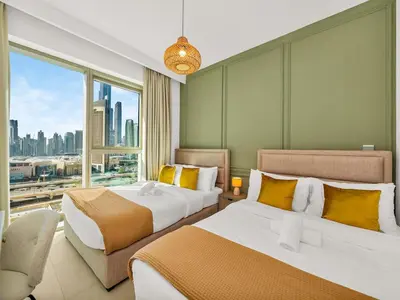 a hotel room with two beds and a large window at Amazing view Burj Khalifa 5mn Dubai Mall 2BDR in Dubai