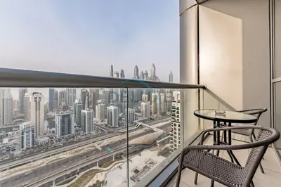 a balcony with a view of a city at Stunning 2BR with Assistant Room in MAG 214, Jumeirah Lake Towers by Deluxe Holiday Homes in Dubai