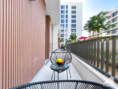 a bowl of fruit sitting on a table on a balcony at Luxury Design & Stunning Views in Dubai Hills in Dubai
