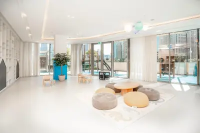 a lobby with tables and chairs in a building at Luxury 1-Bedroom Holiday Apartment in Downtown Dubai I Walk to Dubai Mall and Fountains in Dubai