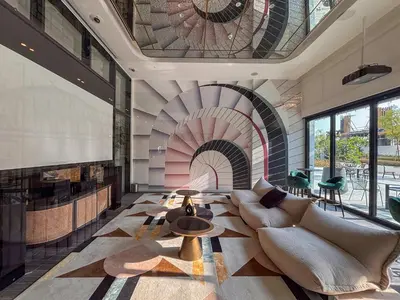 a living room with a couch and a fire place at Frank Porter - Golf Vile in Dubai