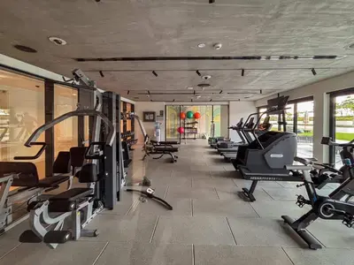 a gym with a bunch of treadmills and machines at Frank Porter - Golf Vile in Dubai