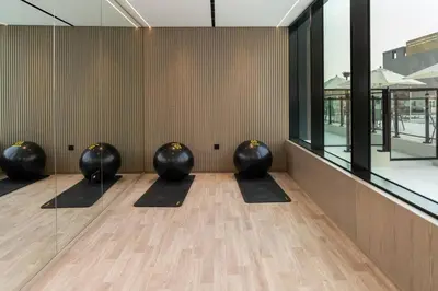 a row of black balls sitting in a room at Sleek 1br Apt Jvc Quiet Space With Pool & Par in Dubai