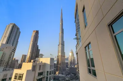a view of the burj khalifa from a city at FIRST CLASS 2BR Burj Khalifa & Fountain View in Dubai