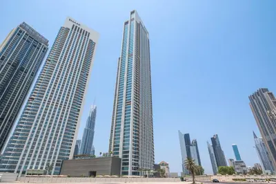a group of tall buildings in a city at Silkhaus Deluxe 2BR in Downtown Views II in Dubai