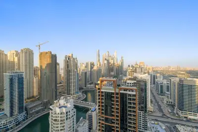 an aerial view of a city with tall buildings at Burj Khalifa & Fountain From Your Balcony Near Dubai Mall & Metro in Dubai