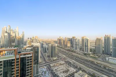 an aerial view of a city with tall buildings at Burj Khalifa & Fountain From Your Balcony Near Dubai Mall & Metro in Dubai