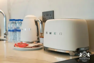 two toasters sitting on top of a counter at Westminster Beach Front in Dubai