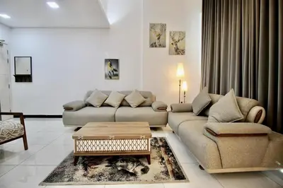 a living room with a couch and a coffee table at 2BR Duplex Stunning Views,Near Circle Mall & Park in Dubai
