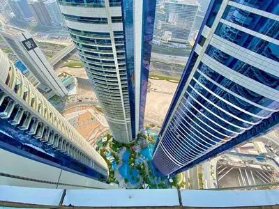 two tall buildings in the middle of a city at Mahogany 1 - 2BR 6 PAX - Amazing Oasis - 1500 sqft in Dubai