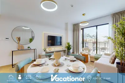 a living room with a table and a couch at La Sirene 3 - Elegant Two Bedroom in Jumeirah 1 in Dubai