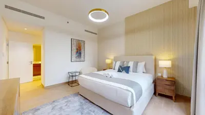 a large white bedroom with a large white bed at La Sirene 3 - Elegant Two Bedroom in Jumeirah 1 in Dubai
