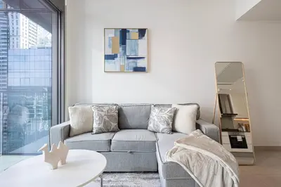 a living room with a couch and a table at High Floor Marina Gate 1 Bdr Flat Only Stays in Dubai