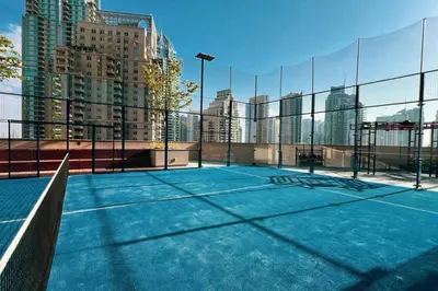 a tennis court in the middle of a city at High Floor Marina Gate 1 Bdr Flat Only Stays in Dubai
