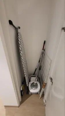 a bathroom with a toilet in the corner of a room at Modern 2BR -5min to Metro-Unit 211 in Dubai