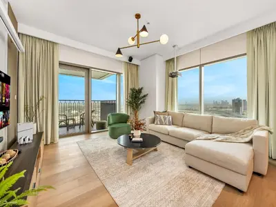 a living room with a couch and a table at The Cinema Suite Luxury 2-Bed Near Dubai Mall in Dubai