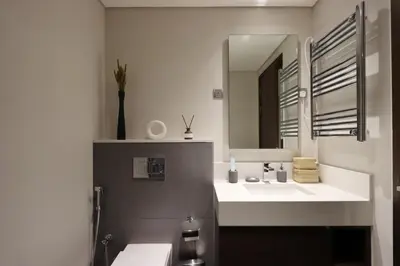 a bathroom with a sink and a mirror at Waterfront 2BR with Dubai Skyline Views in Dubai