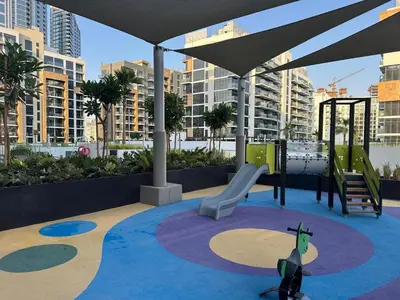a playground with a slide and a play area at Brand New Studio Near Burj khalifa & Dubai Mall in Dubai