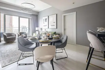 a dining room with a table and chairs at Frank Porter - Damac Heights in Dubai