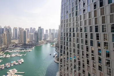 a view of a river between two tall buildings at Frank Porter - Damac Heights in Dubai