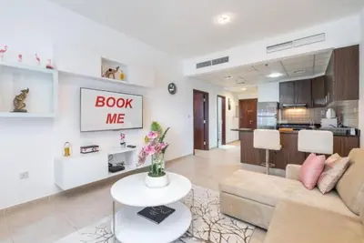 a living room with a couch and a table at 1BHK in central of Dubai Marina in Dubai