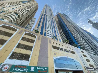 a group of tall buildings in a city at 1BHK in central of Dubai Marina in Dubai