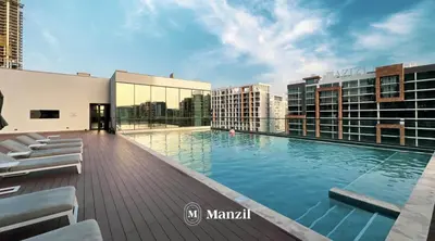 a large swimming pool on the roof of a building at 1BR Apartment in Sobha Hartland with Skyline Views in Dubai